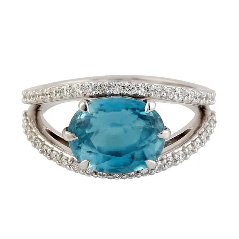 Oval Blue Zircon Solitaire Ring In 18K White Gold With Diamond Halo 1