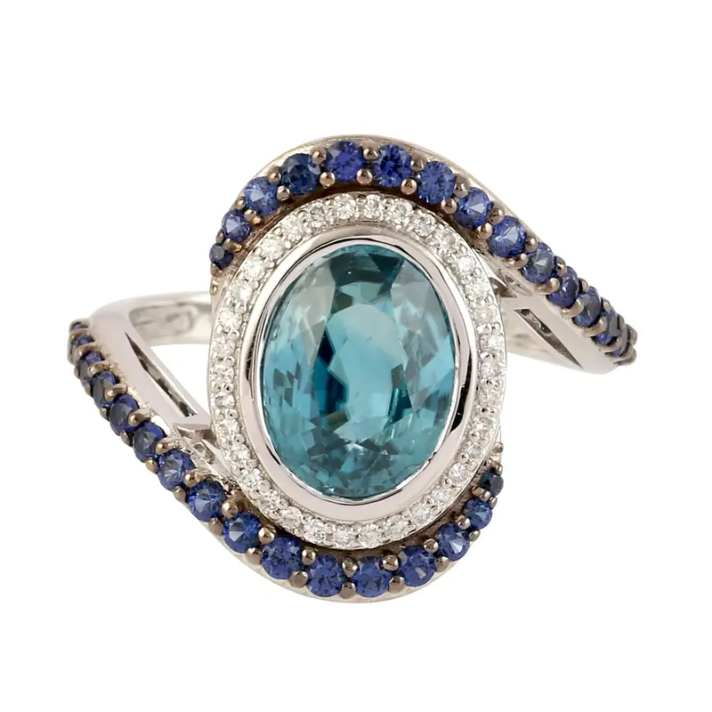 White Gold Solitaire Ring Combining Oval Blue Zirconia, Sapphire, And Diamond Pavé 1